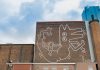 Specialisten renoveren de  ‘Amsterdam Mural’ van Keith Haring